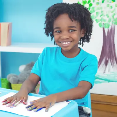 Child creating an art project.